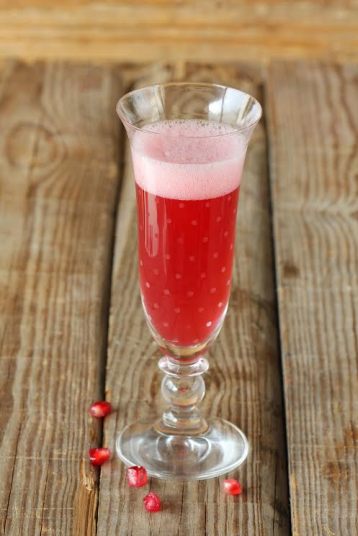  ½ ounces pomegranate liqueur, chilled ½ ounces Triple Sec 3 ounces Champagne Laurent-Perrier Brut, chilled
