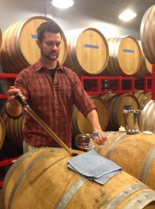 getting a Gewurztraminer barrel sample from the winemaker